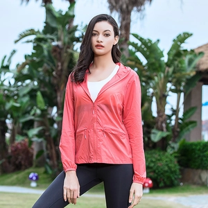 Women's coral red hooded sun protection jacket with zipper pockets and breathable fabric