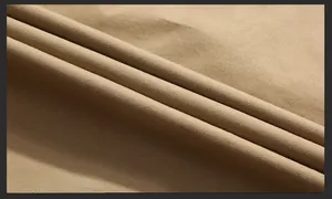 Close-up of khaki twill cotton fabric texture showing high-quality woven patterns and layers