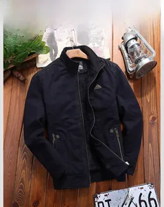 Detailed view of dark blue men's jacket with warm black fleece lining and ribbed cuffs