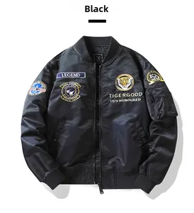 Detail of tiger embroidery and military patches on black MA1 pilot bomber jacket