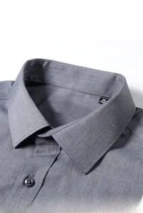 Detailed macro view of gray men's slim fit dress shirt collar with high quality stitching