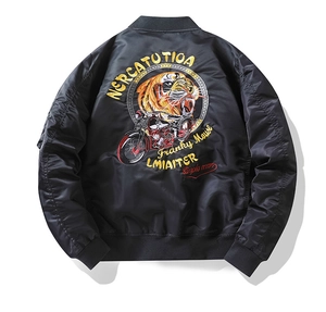 Detailed embroidery of tiger and motorcycle motifs on a black nylon bomber jacket back