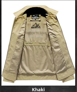 Detailed inner view of khaki cotton jacket with mountain print and internal pockets