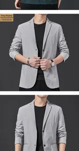 Detail of light grey casual blazer showing textured breathable fabric and classic lapel