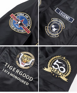 Detailed close-up showing high-density tiger embroidery and military patches on bomber jacket