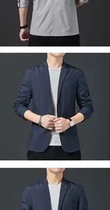 Detail of slim fit dark blue blazer featuring a fine white polka dot texture pattern
