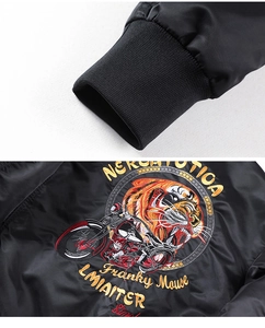 Detailed embroidery of tiger and motorcycle motifs on black MA1 pilot jacket sleeves
