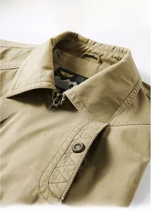 Detail view of khaki cotton jacket featuring classic lapel and snap button side pockets
