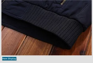 Detail view of winter jacket hem featuring elastic ribbed cuffs and metal zipper quality