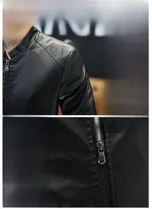 Detailed view of mandarin collar and shoulder stitching on black faux leather jacket