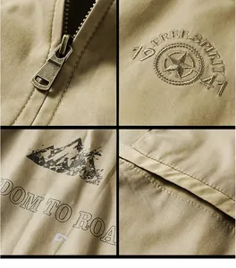 Detail view of khaki cotton jacket featuring vintage metal zipper and embroidery