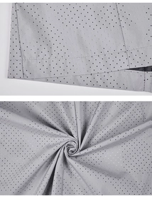 Detailed close-up showing the grey polka dot fabric texture and high-quality stitching