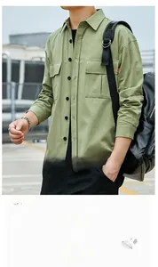 Detail of avocado green cotton utility shirt featuring chest pockets and black buttons