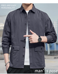Detail of dark gray casual work shirt featuring large flap pockets and black buttons