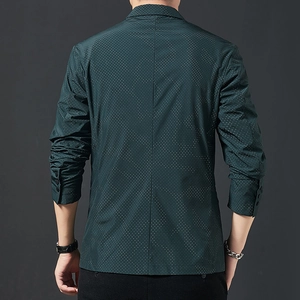 Slim fit men's dark green suit jacket with white polka dots and back slit detail