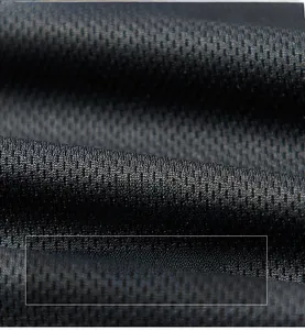 Close-up of black breathable honeycomb mesh lining fabric with soft matte texture