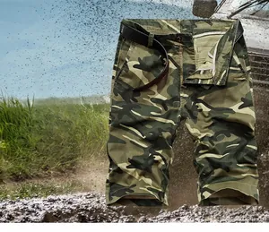Rugged jungle camouflage cargo shorts with leather belt in a mud splashing outdoor scene