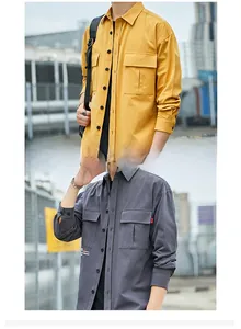 Detail of mustard yellow and dark grey cotton cargo shirts with large flap chest pockets