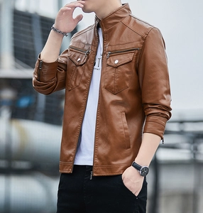 Detail of men's brown leather jacket showing stand collar and multi-pocket zippers
