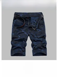 Detail of dark blue camouflage men's shorts showing cotton twill fabric and black belt