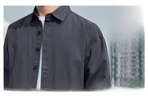 Detail of dark grey casual shirt collar and textured fabric with front buttons