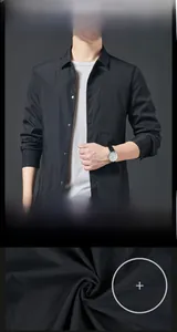 Close-up of black casual men's jacket showing classic collar and premium fabric texture