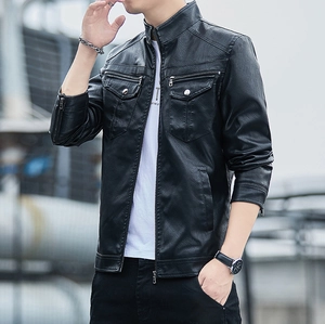 Close-up of black biker leather jacket featuring lychee texture and metallic zip details