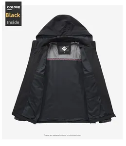 Detail of black hooded jacket interior featuring breathable grey mesh and red woven trim