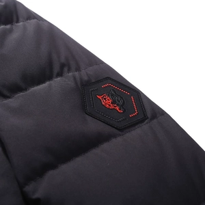 Men's winter puffer jacket in black featuring a detailed sleeve embroidery badge