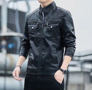Close-up of black biker jacket featuring stand collar and silver metal pocket details