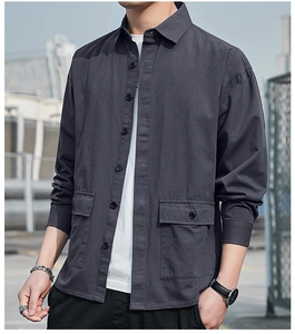 Close-up of charcoal grey cotton work shirt with double flap pockets and twill texture
