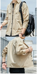 Detail of khaki cotton utility shirt with double chest pockets and industrial print