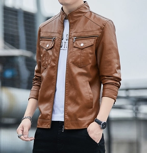 Detail of a brown faux leather jacket with stand-up collar and metal zipper pockets