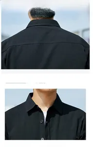 Detail of classic black shirt showing crisp point collar and premium button-down texture
