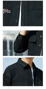 Detail view of black workwear shirt featuring chest pockets and contrast stitching details
