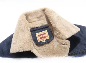 Close-up of winter denim jacket with warm beige faux fur collar and FOOCHIGER brand label