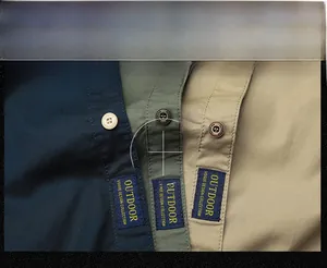 Close-up of cotton cargo shirts in navy, olive and khaki showing buttons and outdoor labels