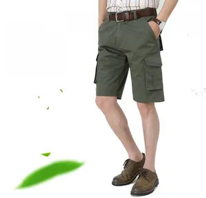Detail of olive green cargo shorts with large pockets and a brown leather belt