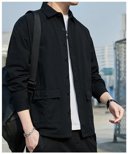 Detailed view of black cargo style jacket featuring large flap pockets and classic collar