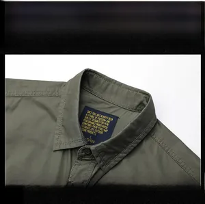 Detailed view of the olive green cotton shirt collar with brand label and fine stitching