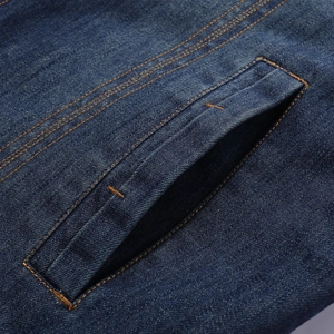 Deep blue denim cotton jacket with orange contrast stitching and side pocket detail