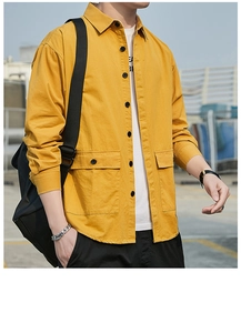 Close-up of a men's yellow cargo shirt jacket with large flap pockets and black buttons