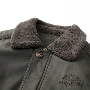 Men's olive green canvas jacket with warm sherpa collar and Freespirit 1941 embroidery