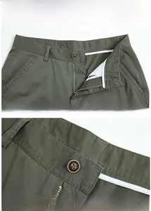 Detail view of olive green cotton shorts showing marble-textured button and zipper closure
