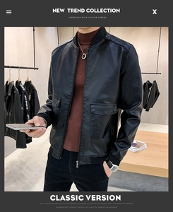 Detail of men's slim fit black PU leather jacket featuring chest pockets and ribbed cuffs