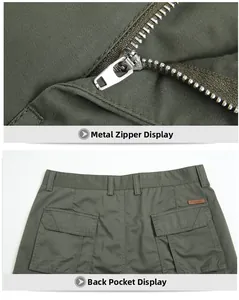 Detail of army green cotton shorts featuring a metal zipper and flap back pockets
