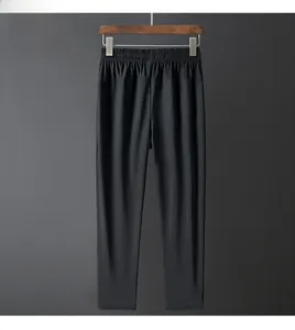 Detailed view of lightweight black ice silk pants featuring an elastic drawstring waistband