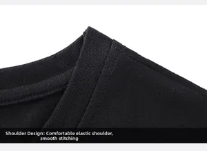 Detail of double-stitched shoulder seams on a black cotton crew neck t-shirt