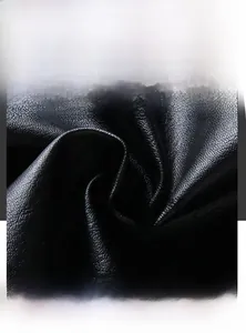 Close-up of black PU leather fabric showing durable litchi texture for men jackets