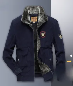 Detail view of corduroy winter jacket showing thick gray faux fur lining and texture